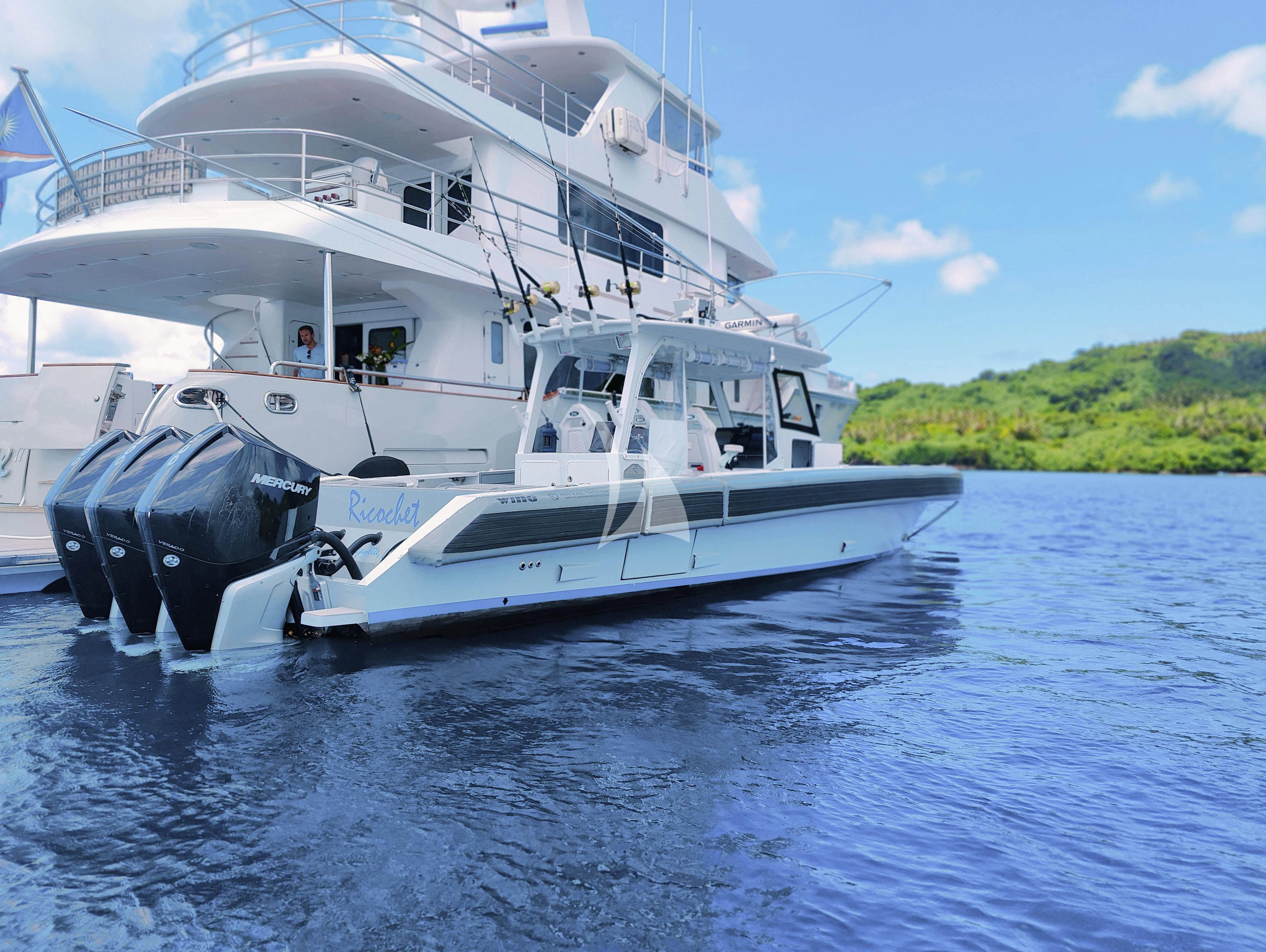 a white boat on water aboard VIVIERAE II Yacht for Sale