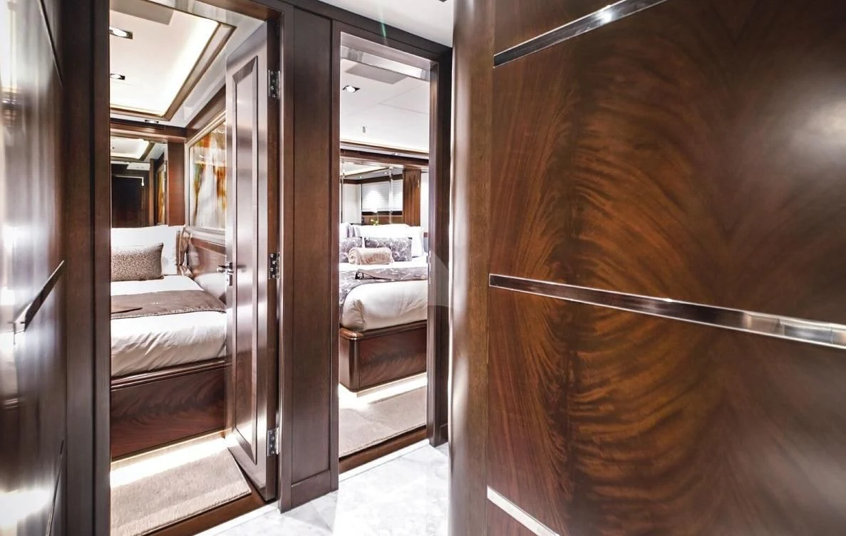 a room with a bed and a mirror aboard VIVIERAE II Yacht for Sale