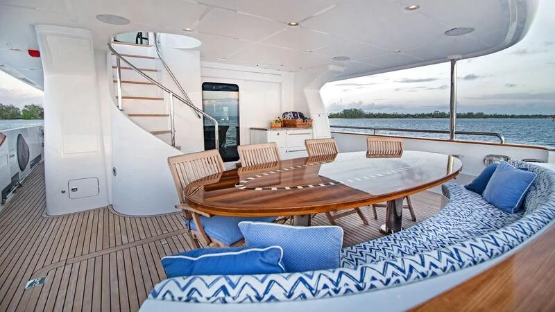 a table and chairs on a boat aboard VIVIERAE II Yacht for Sale