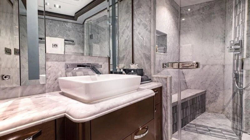 a bathroom with a sink and a mirror aboard VIVIERAE II Yacht for Sale