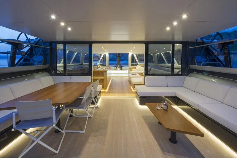 a room with a couch and a table and chairs aboard ALLEGRA Yacht for Sale