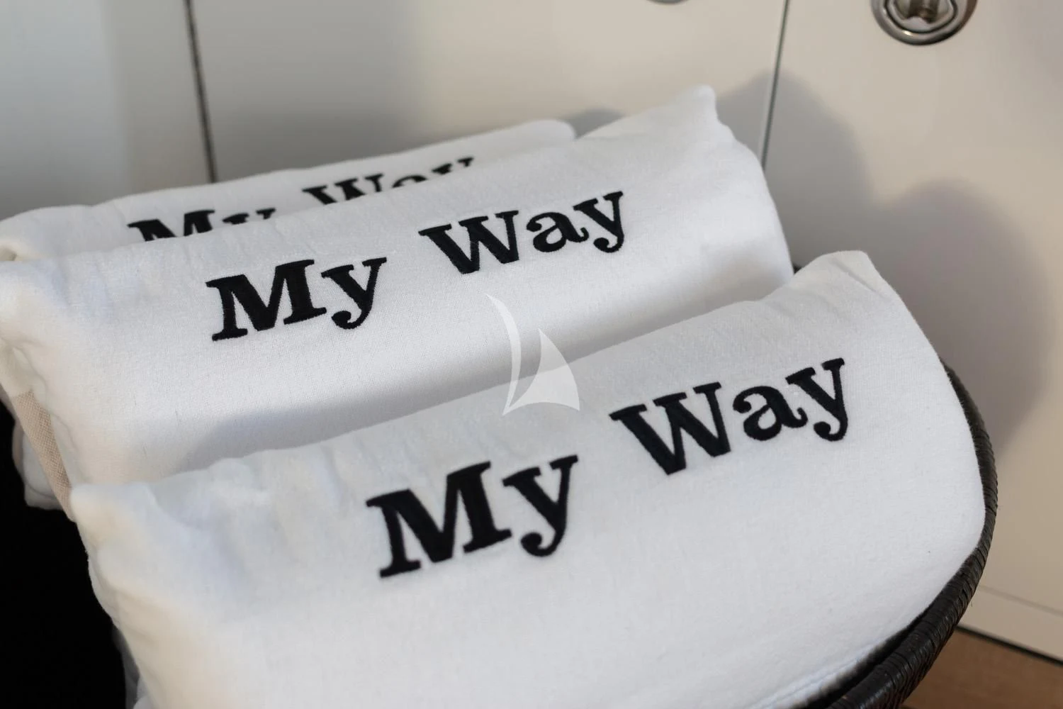 a white frisbee with black text on it aboard MY WAY Yacht for Sale