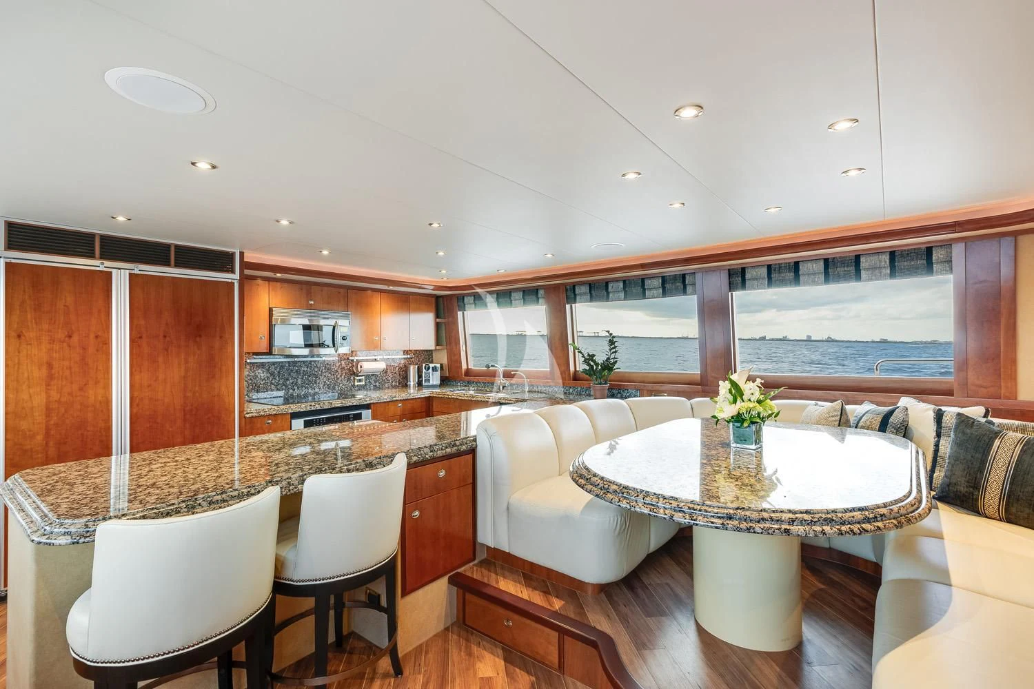 a kitchen with a table and chairs aboard MY WAY Yacht for Sale