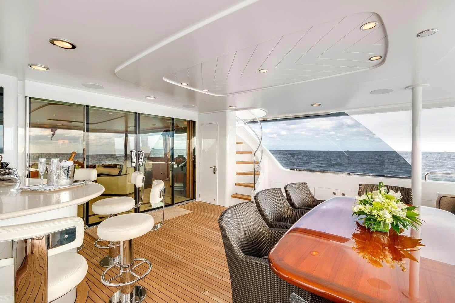 a room with a table chairs and a large window aboard MY WAY Yacht for Sale