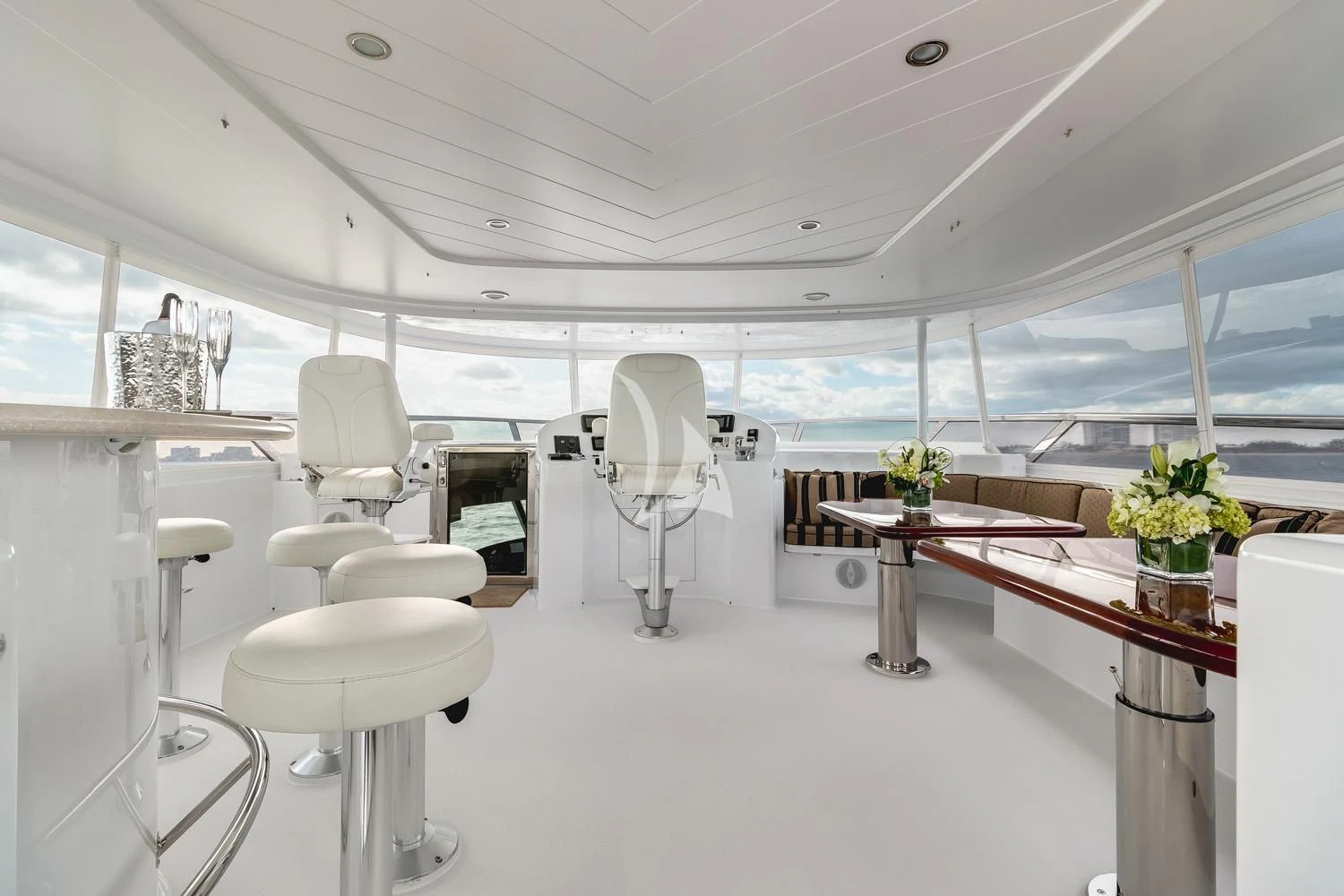 a room with a table chairs and a fan aboard MY WAY Yacht for Sale