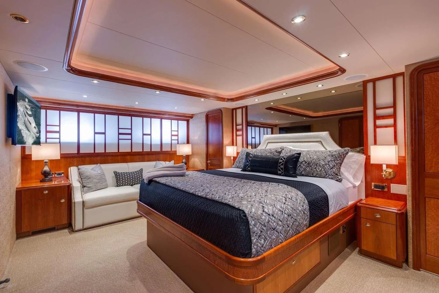 a bedroom with a bed and a couch aboard MY WAY Yacht for Sale