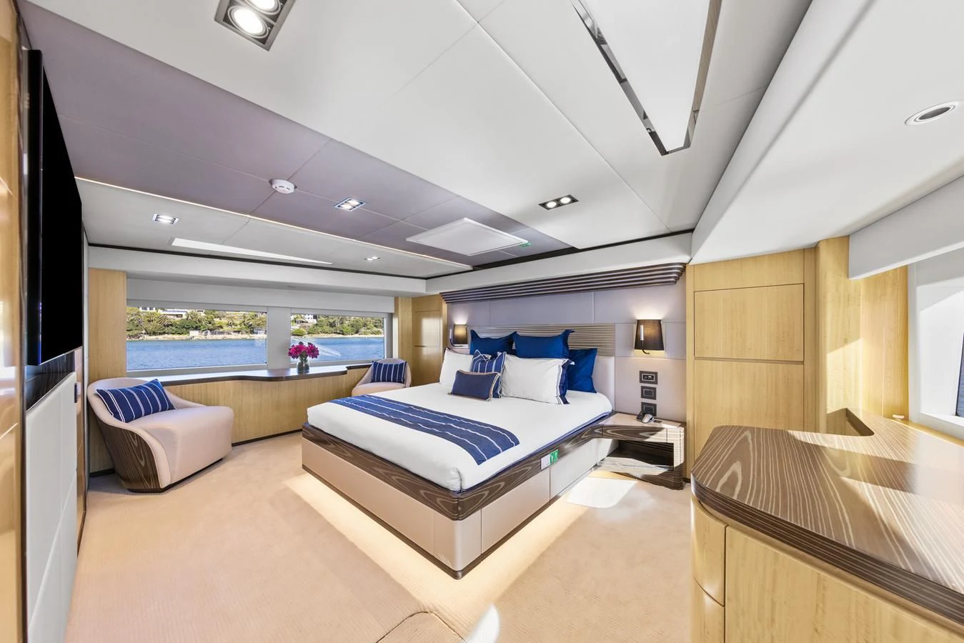 a room with a bed and a pool aboard LEGACY Yacht for Sale