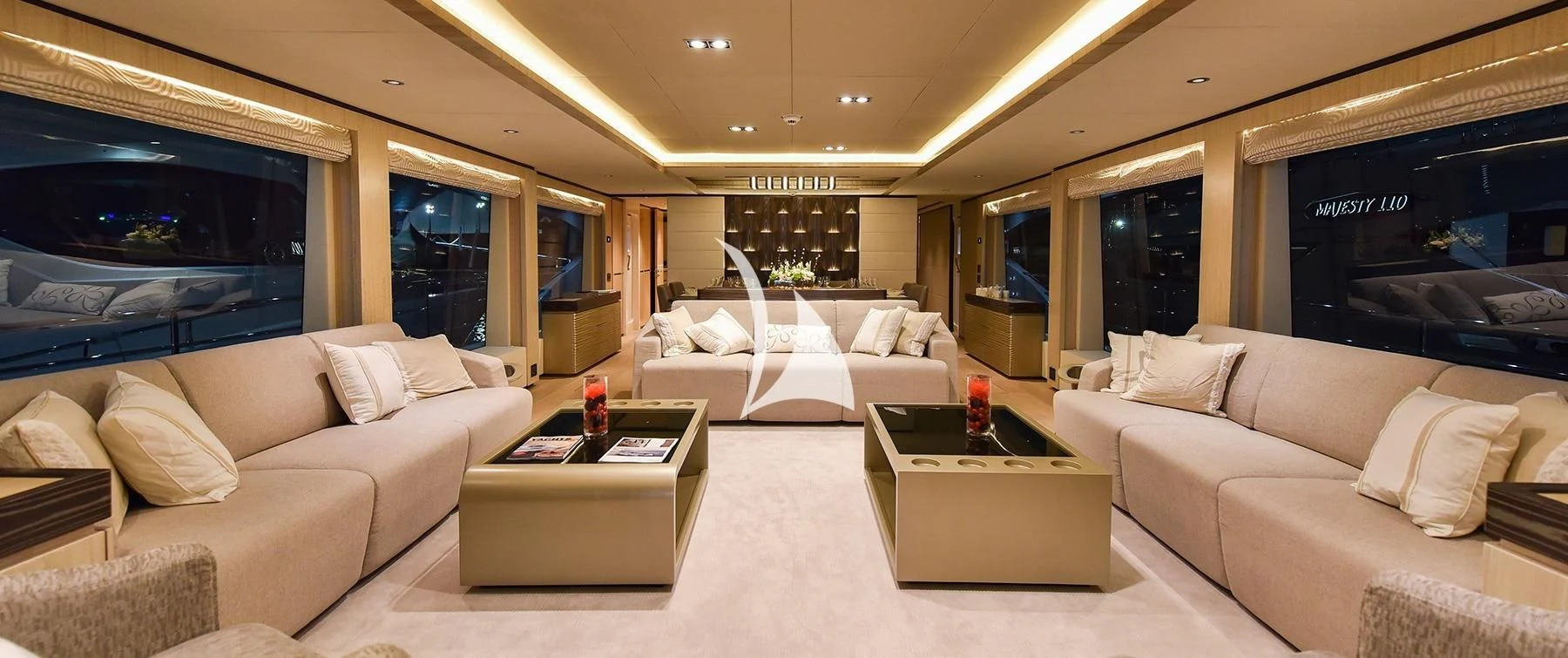 a living room with a couch and a coffee table aboard LEGACY Yacht for Sale