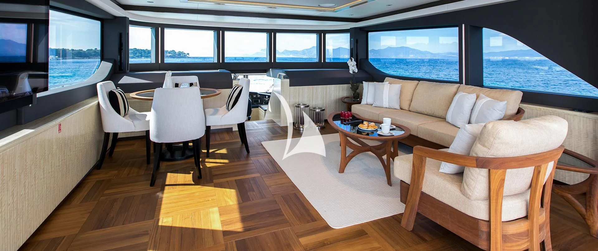 a room with a couch and a table and chairs aboard LEGACY Yacht for Sale