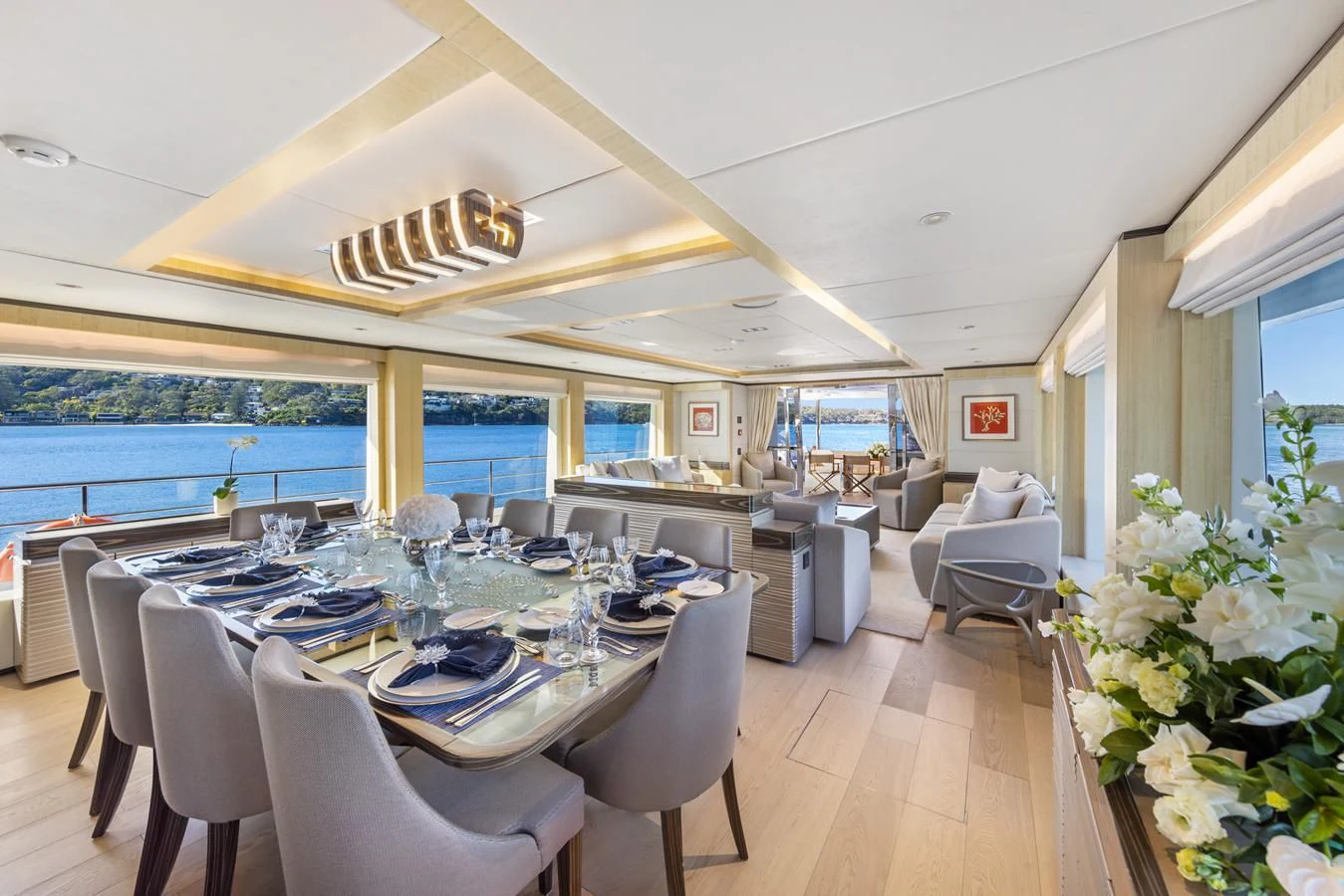 a large dining room with a large table and chairs aboard LEGACY Yacht for Sale