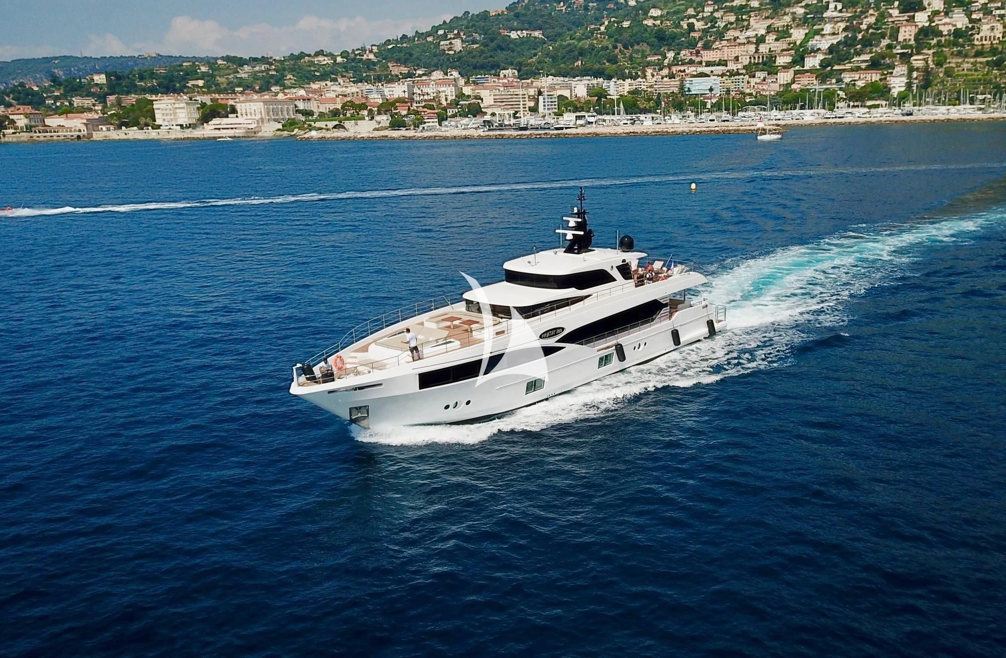 a white boat on the water aboard LEGACY Yacht for Sale