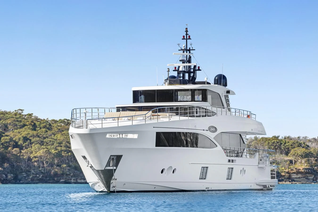 a large white boat in the water aboard LEGACY Yacht for Sale