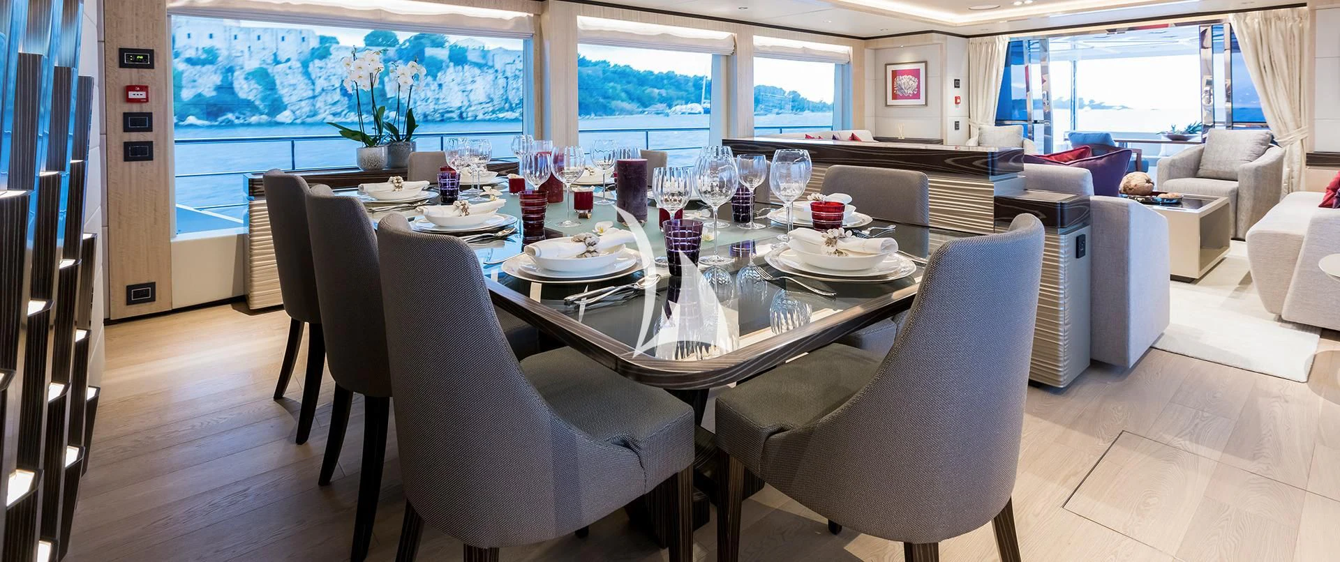 a large white table with chairs around it aboard LEGACY Yacht for Sale