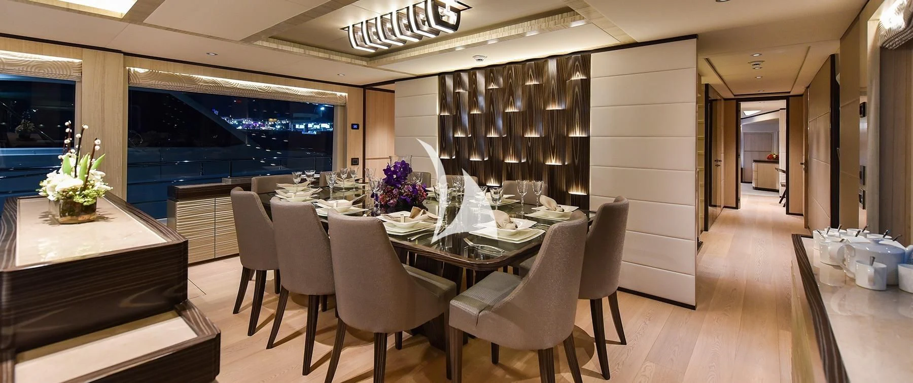 a large room with tables and chairs aboard LEGACY Yacht for Sale