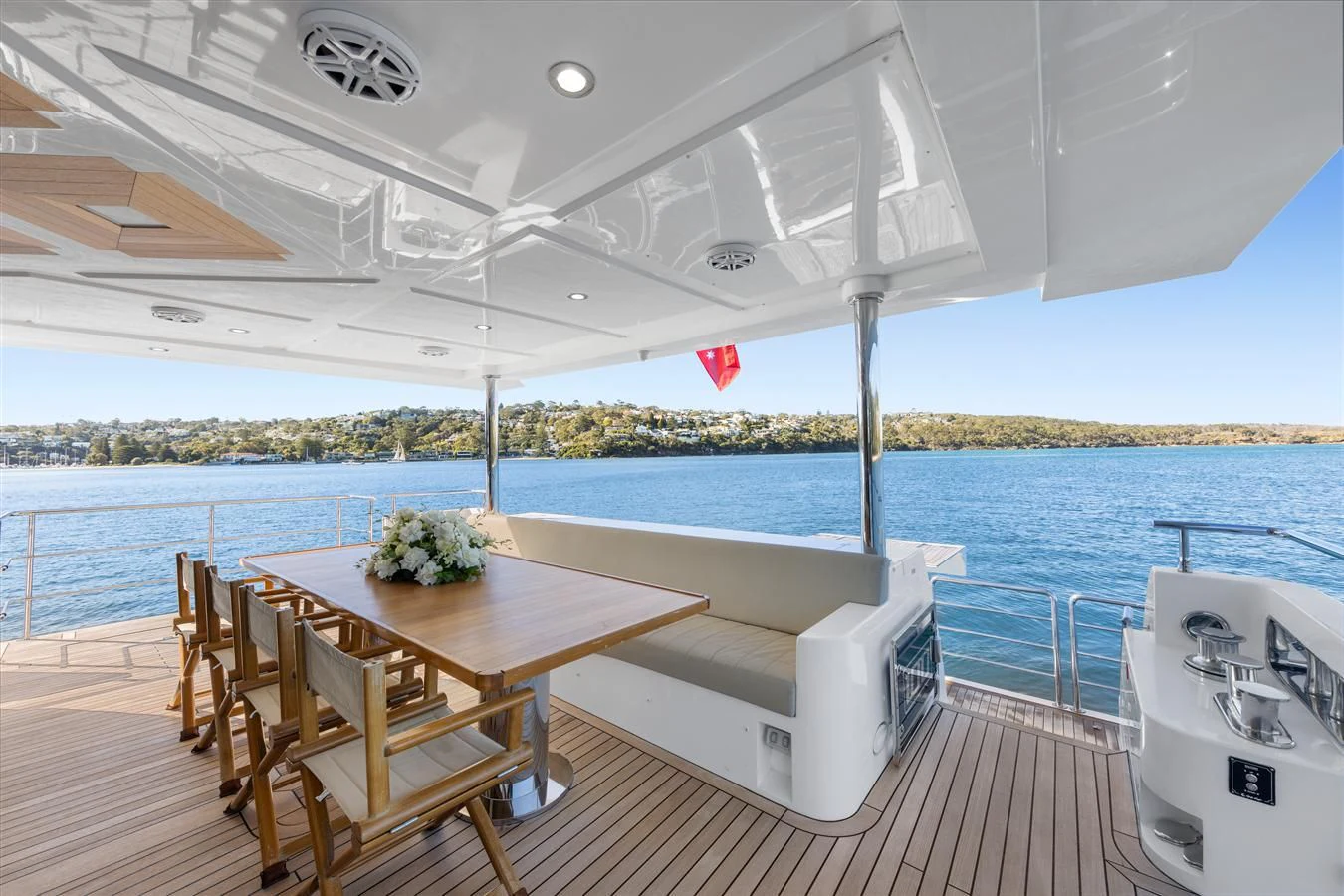 a table and chairs on a deck aboard LEGACY Yacht for Sale