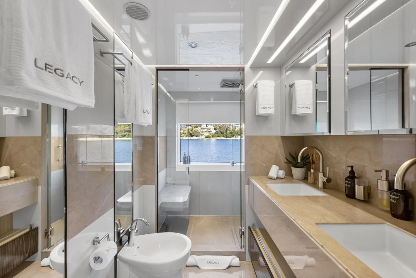 a bathroom with a large window aboard LEGACY Yacht for Sale