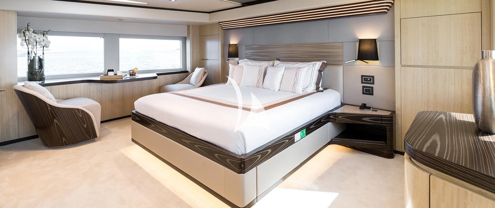 a room with a bed and a couch aboard LEGACY Yacht for Sale