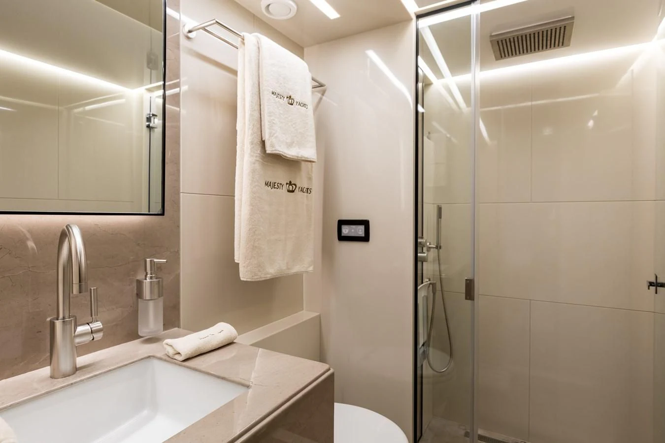 a bathroom with a shower unit and sink aboard LEGACY Yacht for Sale