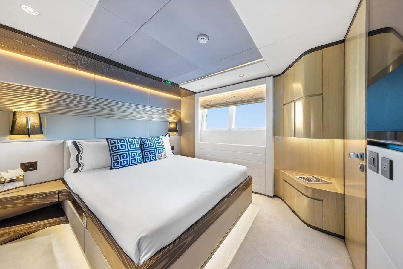 a room with a bed and a desk aboard LEGACY Yacht for Sale