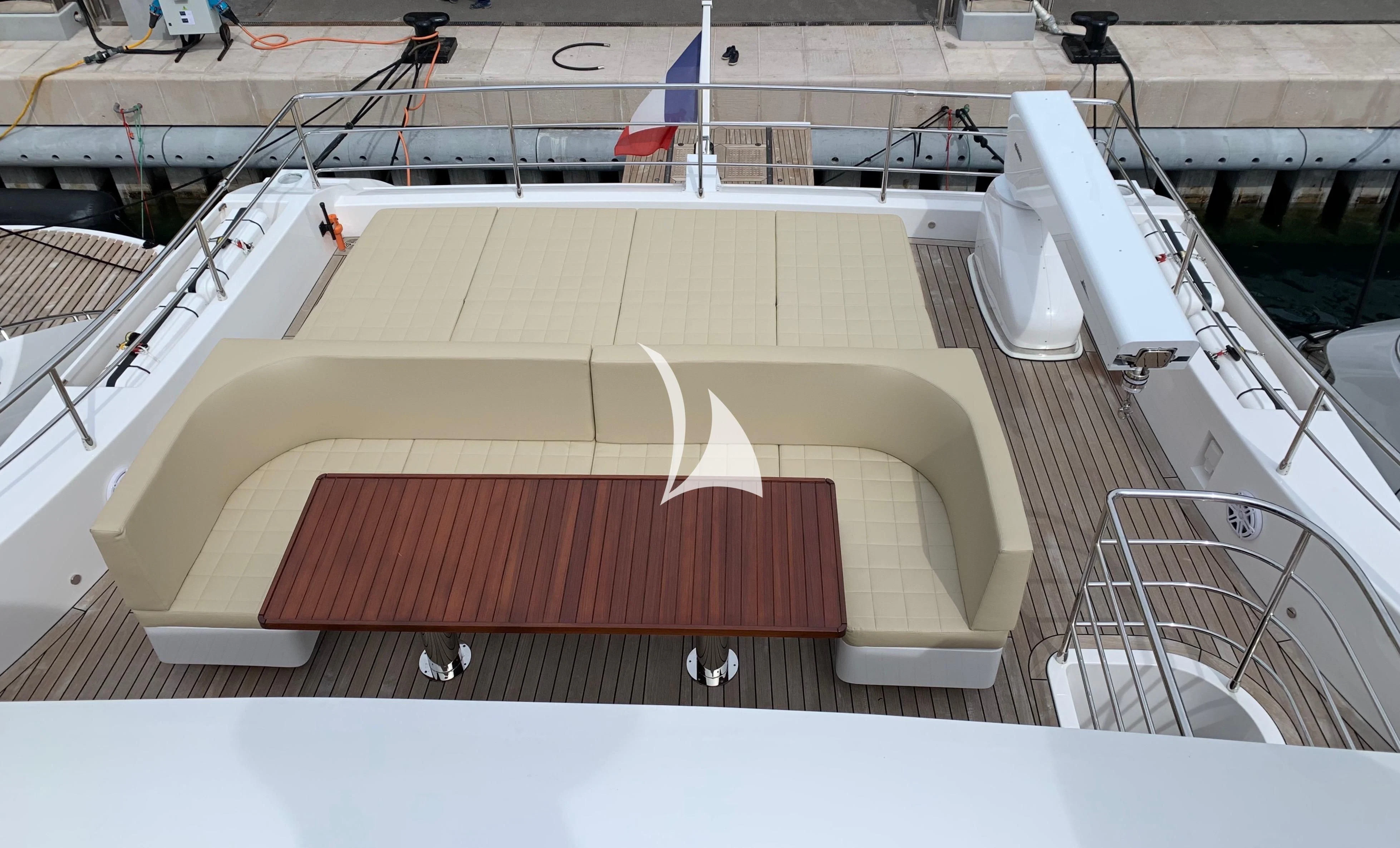 a large wooden staircase aboard LEGACY Yacht for Sale