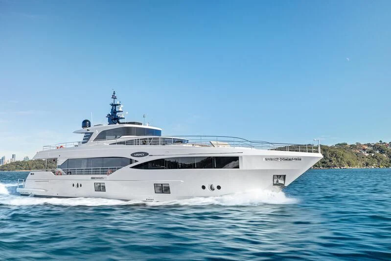 a white yacht on the water aboard LEGACY Yacht for Sale