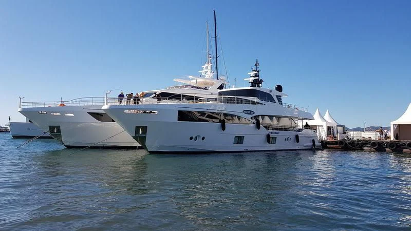 a couple of large white boats aboard LEGACY Yacht for Sale