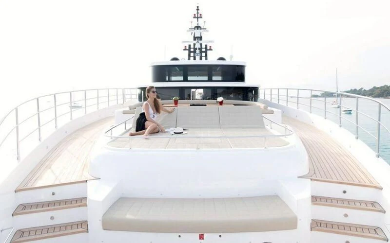 a person sitting on a rooftop aboard LEGACY Yacht for Sale