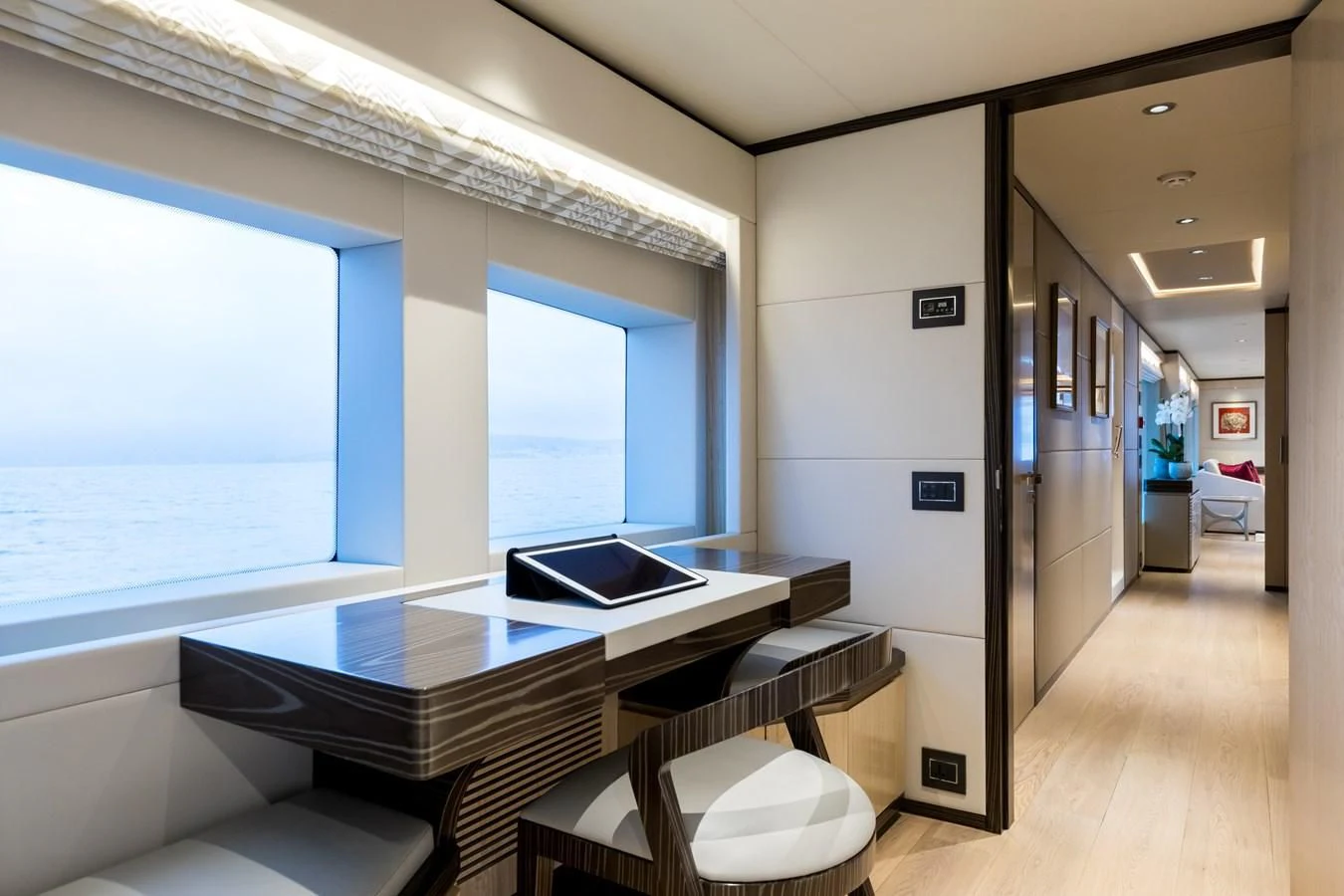 a room with a table and chairs aboard LEGACY Yacht for Sale