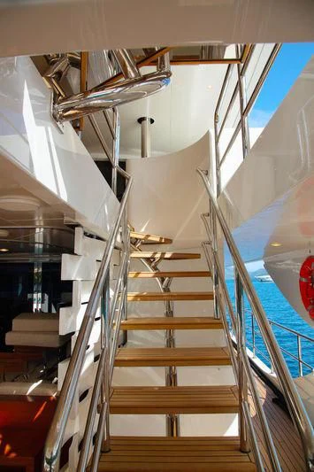 a close-up of a white staircase aboard VICA Yacht for Sale