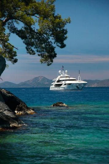 a white boat in the water aboard VICA Yacht for Sale