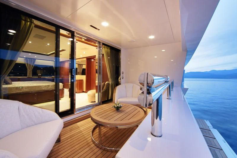 a room with a table chairs and a large window aboard VICA Yacht for Sale