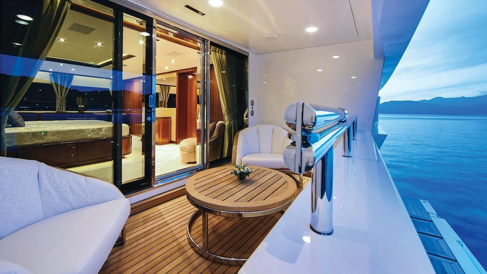a room with a table and chairs aboard VICA Yacht for Sale