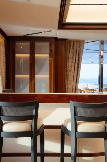 a room with chairs and a table aboard VICA Yacht for Sale