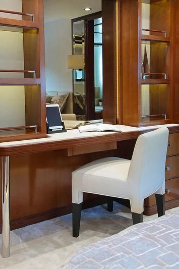 a white chair in a room aboard VICA Yacht for Sale