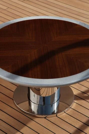 a metal bucket on a wood floor aboard VICA Yacht for Sale