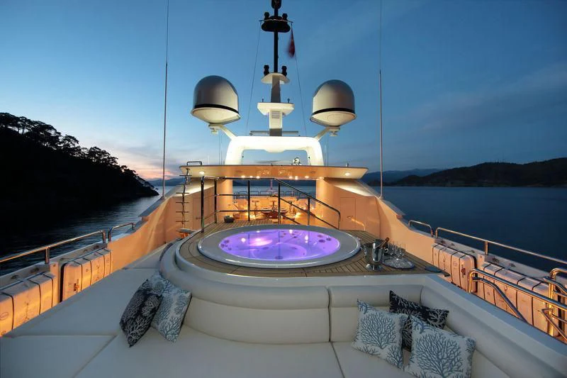 a large round pool with a round purple round object on top of it aboard VICA Yacht for Sale