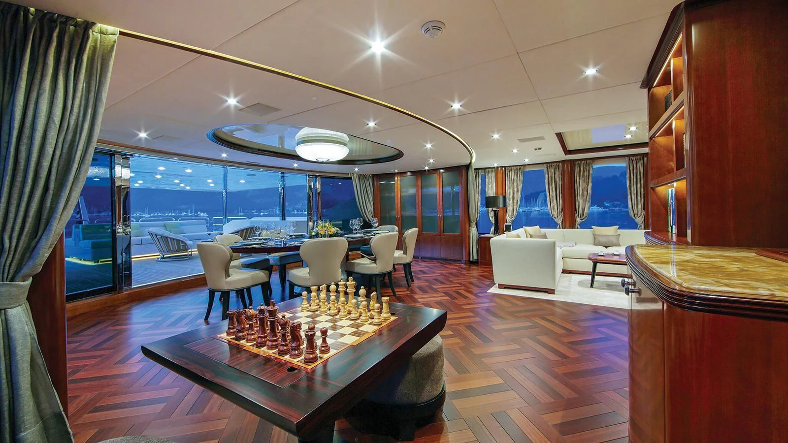 a room with a table and chairs aboard VICA Yacht for Sale