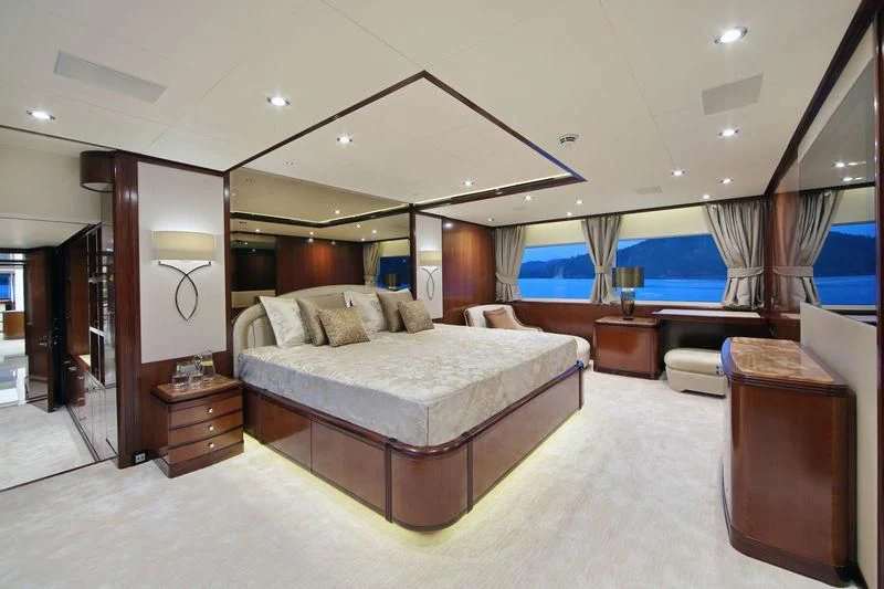 a large bedroom with a large bed aboard VICA Yacht for Sale