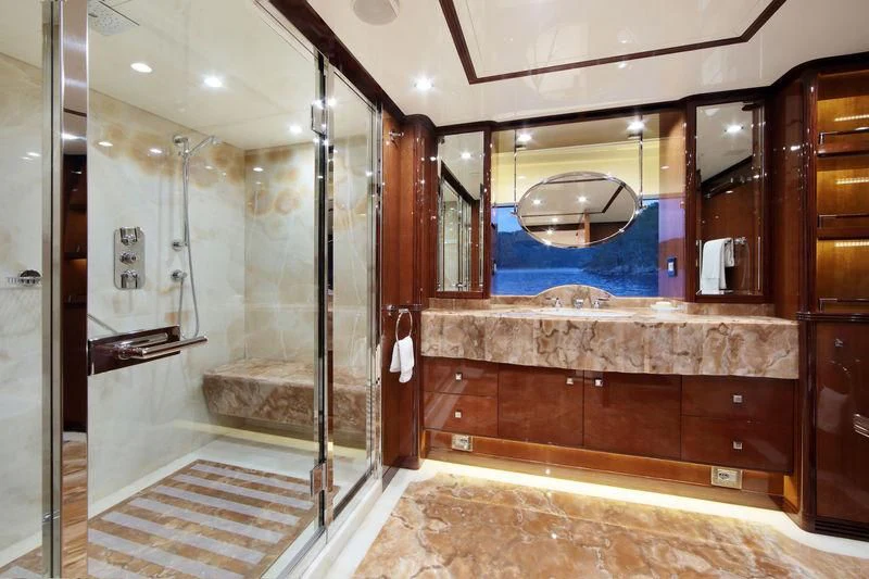 a bathroom with a large mirror aboard VICA Yacht for Sale