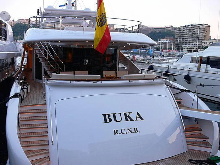 a boat with a flag on the front aboard BUKA U Yacht for Sale