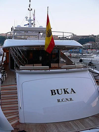 a boat with a flag on the front aboard BUKA U Yacht for Sale