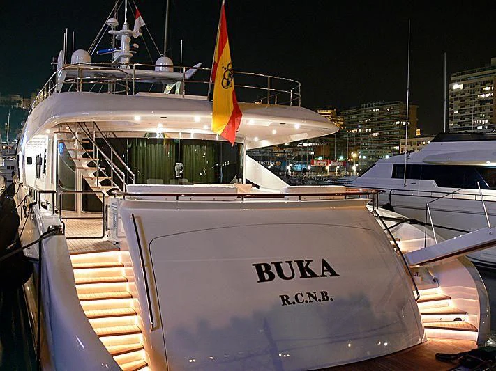 a boat with a flag on the front aboard BUKA U Yacht for Sale