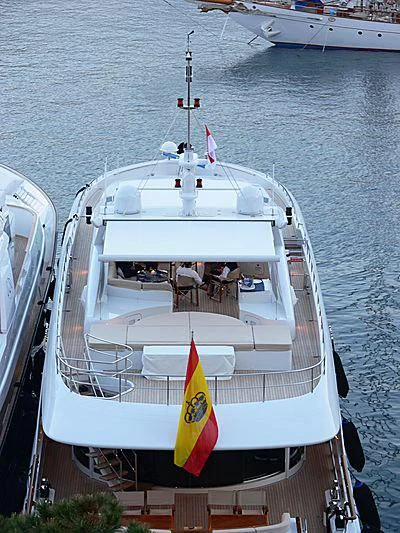 a boat with a flag on it aboard BUKA U Yacht for Sale