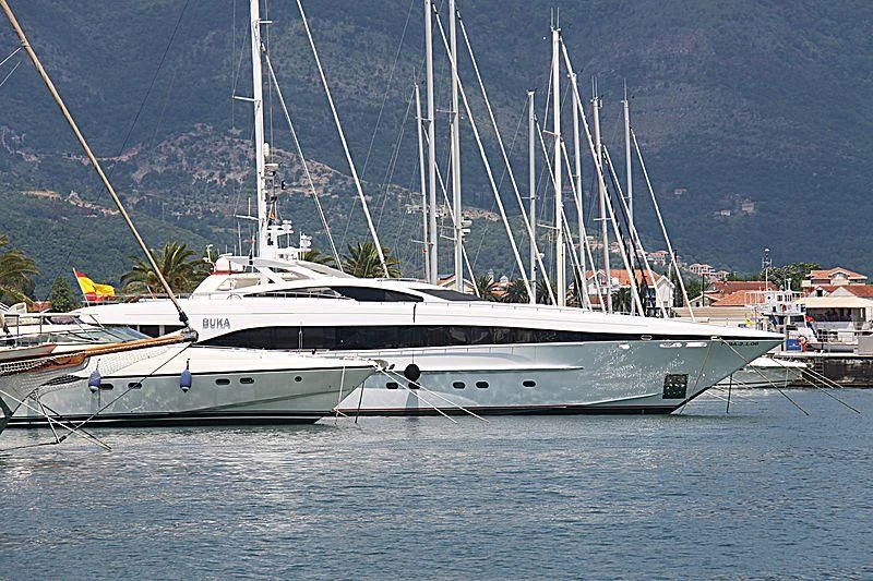 a boat docked at a pier aboard BUKA U Yacht for Sale