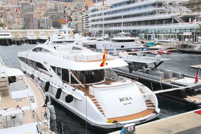 a group of boats are parked in a harbor aboard BUKA U Yacht for Sale