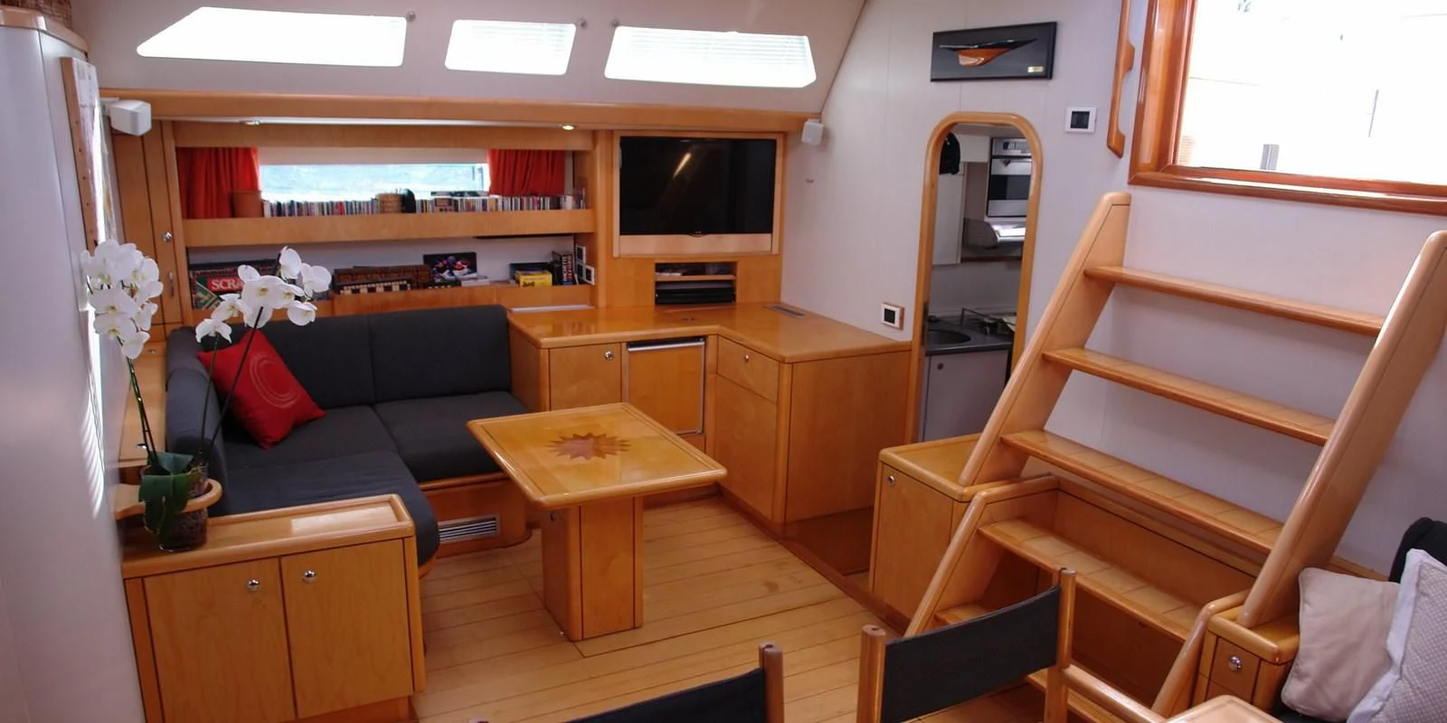 a living room with a couch and a tv aboard DJANGO TOO Yacht for Charter