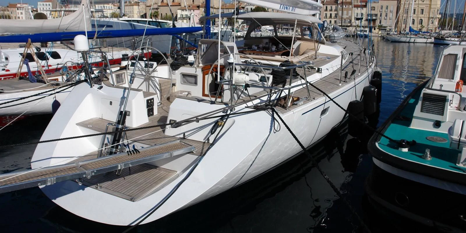 a group of boats are parked in a harbor aboard DJANGO TOO Yacht for Charter