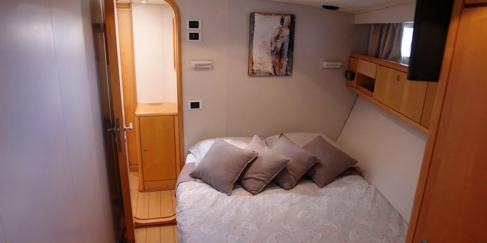 a bed with pillows aboard DJANGO TOO Yacht for Charter