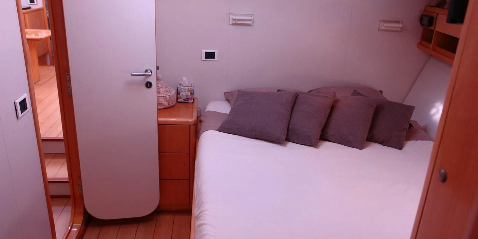 a bed with pillows aboard DJANGO TOO Yacht for Charter