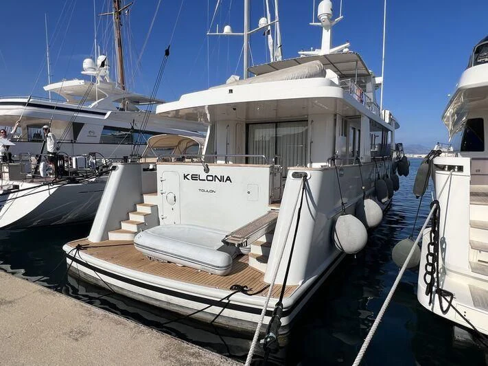 a boat docked at a pier aboard KELONIA Yacht for Sale